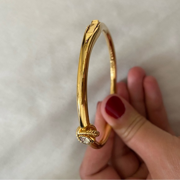 KATE SPADE INFINITY AND BEYOND KNOT CRYSTAL BANGLE IN GOLD - Picture 11 of 12